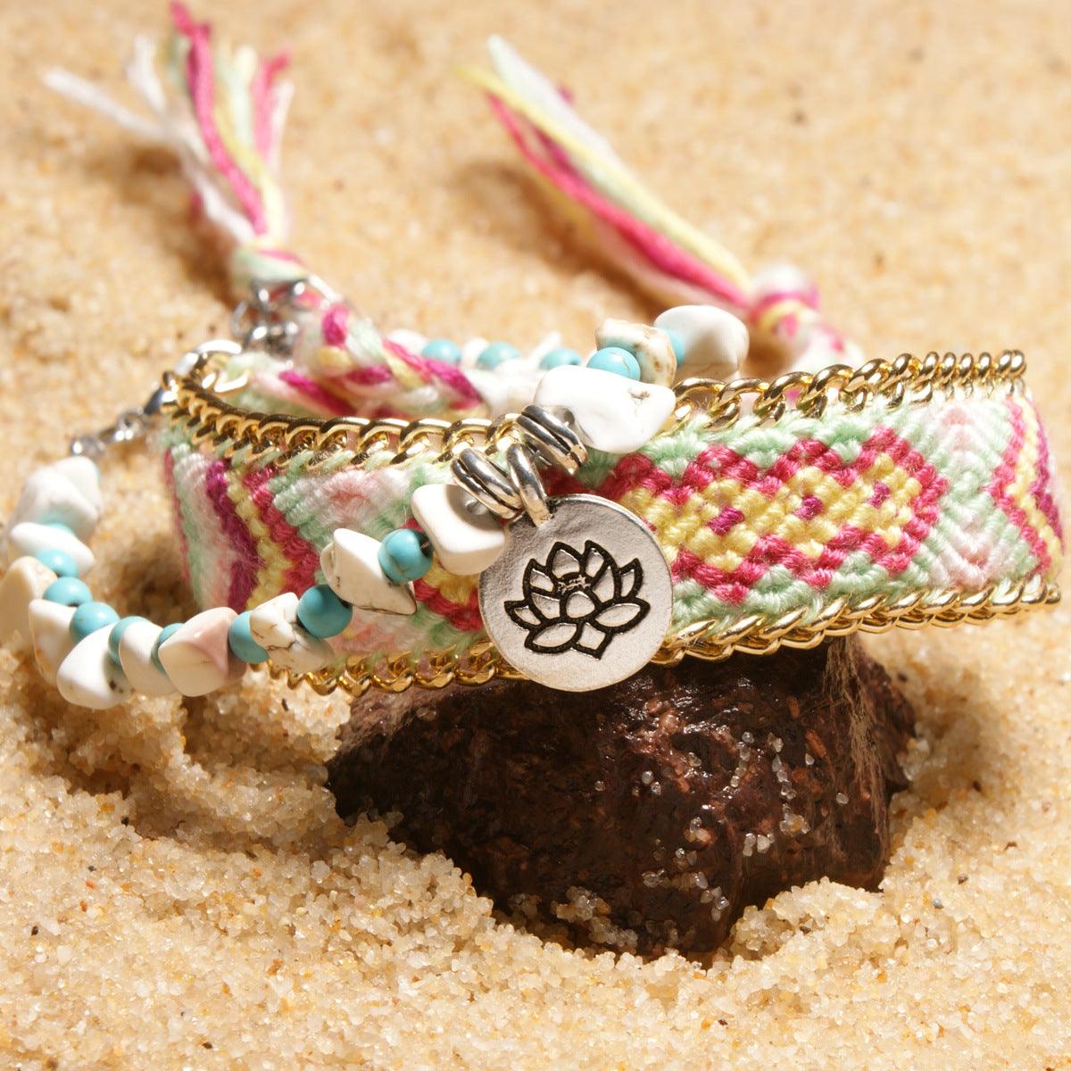 Close-up of the lotus charm adorned with turquoise and shell beads, capturing intricate craftsmanship and a serene aesthetic.